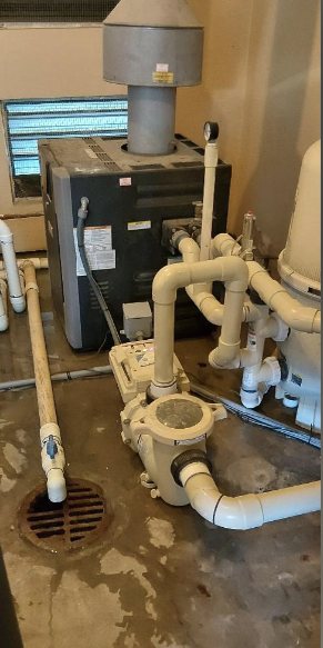 Pool heater, pump, and filter on an equipment pad serviced by Roadrunner