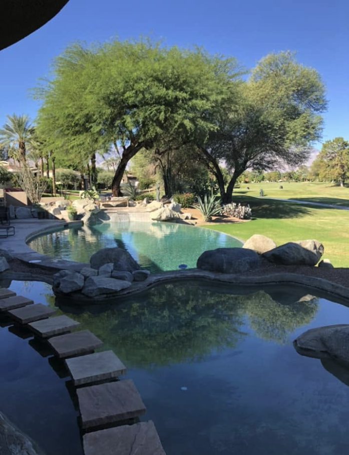 Rock waterfall pool on weekly service by Roadrunner in the Coachella Valley